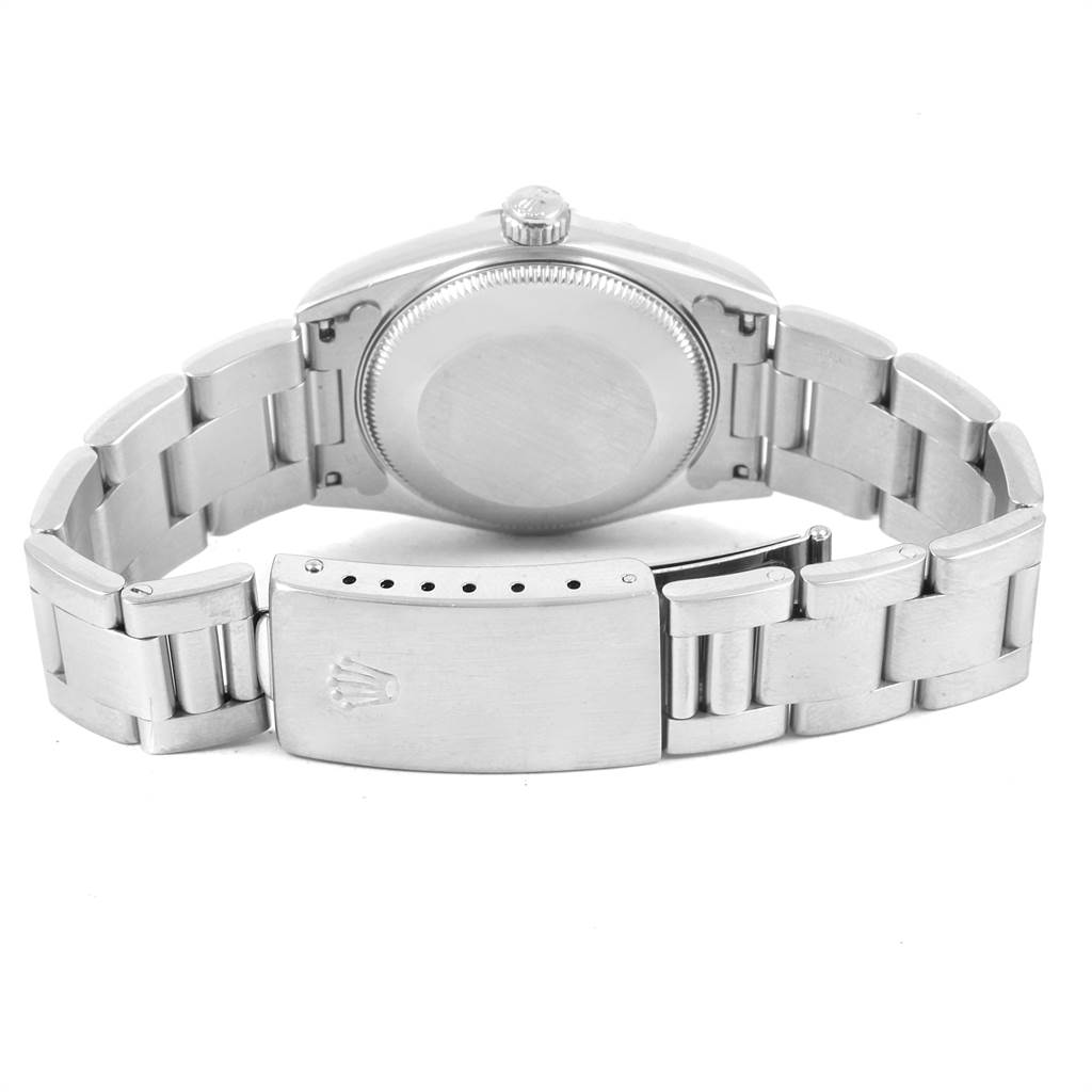 The image shows the back view of the case, crown, and metal bracelet of a Mid-Size Rolex watch.