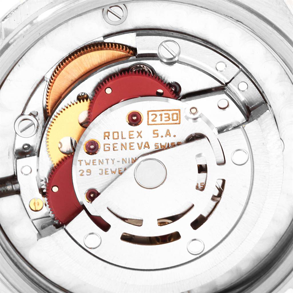 The image shows the internal mechanical movement of a Mid-Size Rolex watch, viewed from the back.
