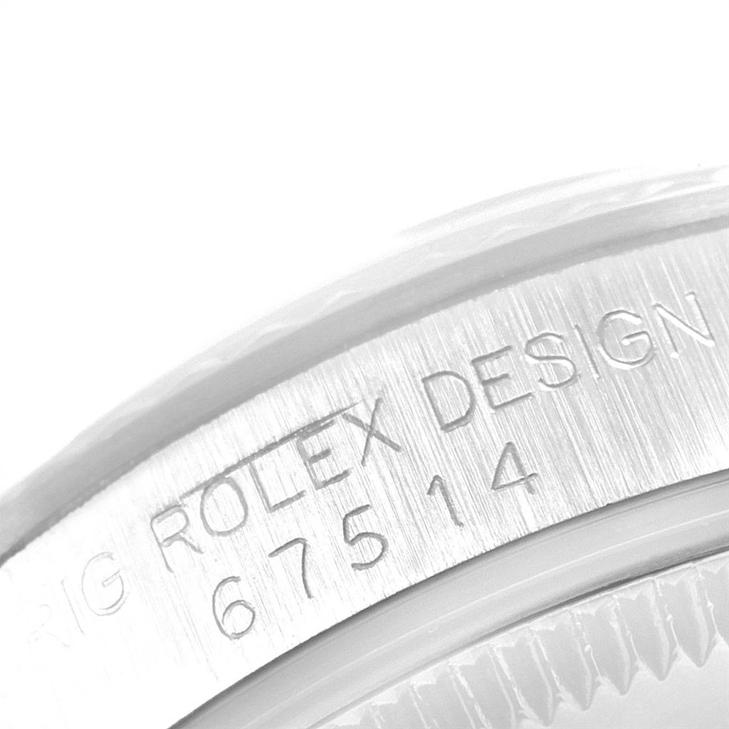This image shows an angle of the watch case showing "Rolex Design" and the model number for a Mid-Size Rolex watch.