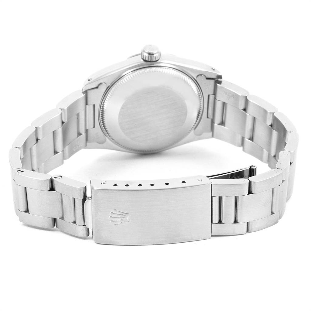 This image shows the backside, case back, and bracelet (clasp) of the Rolex Mid-Size 67514 Women's Stainless Steel Silver Dial 67514 Women's Stainless Steel Silver Dial model.