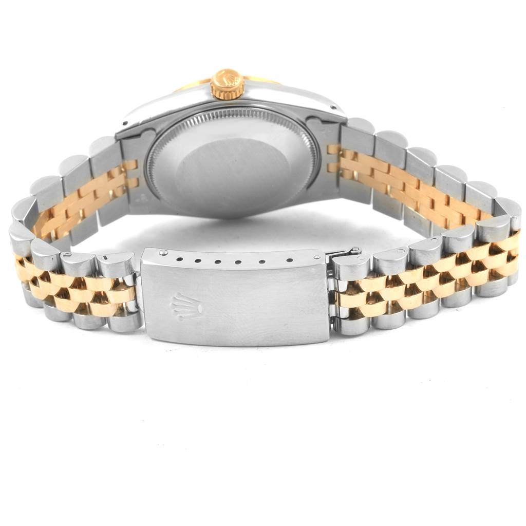 The image shows the back of a Rolex Mid-Size 68273 Women's Steel and Gold (two tone) Champagne Dial 68273 Women's Steel and Gold (two tone) Champagne Dial watch, highlighting the case and two-tone bracelet with the clasp.