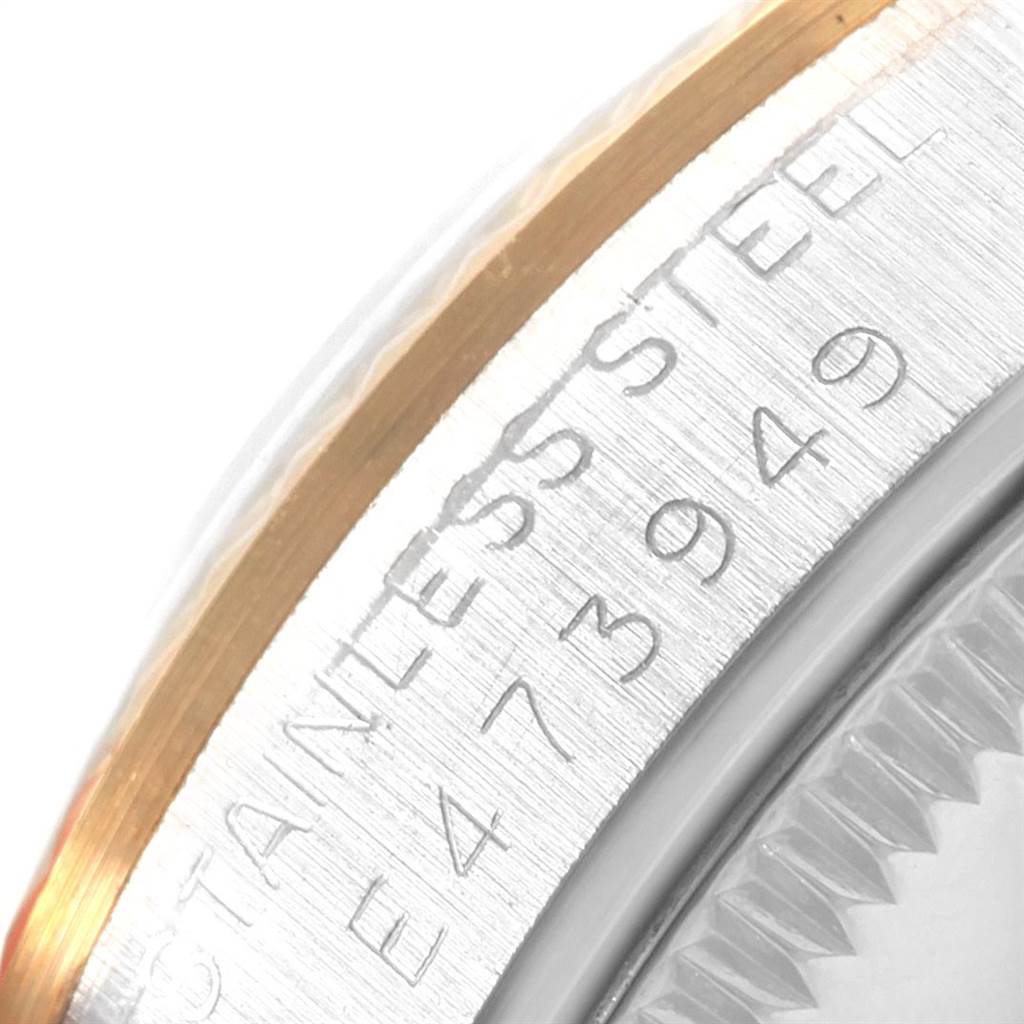 This image shows a close-up of the side case of a Rolex Mid-Size 68273 Women's Steel and Gold (two tone) Champagne Dial 68273 Women's Steel and Gold (two tone) Champagne Dial model, featuring the bezel and serial number.