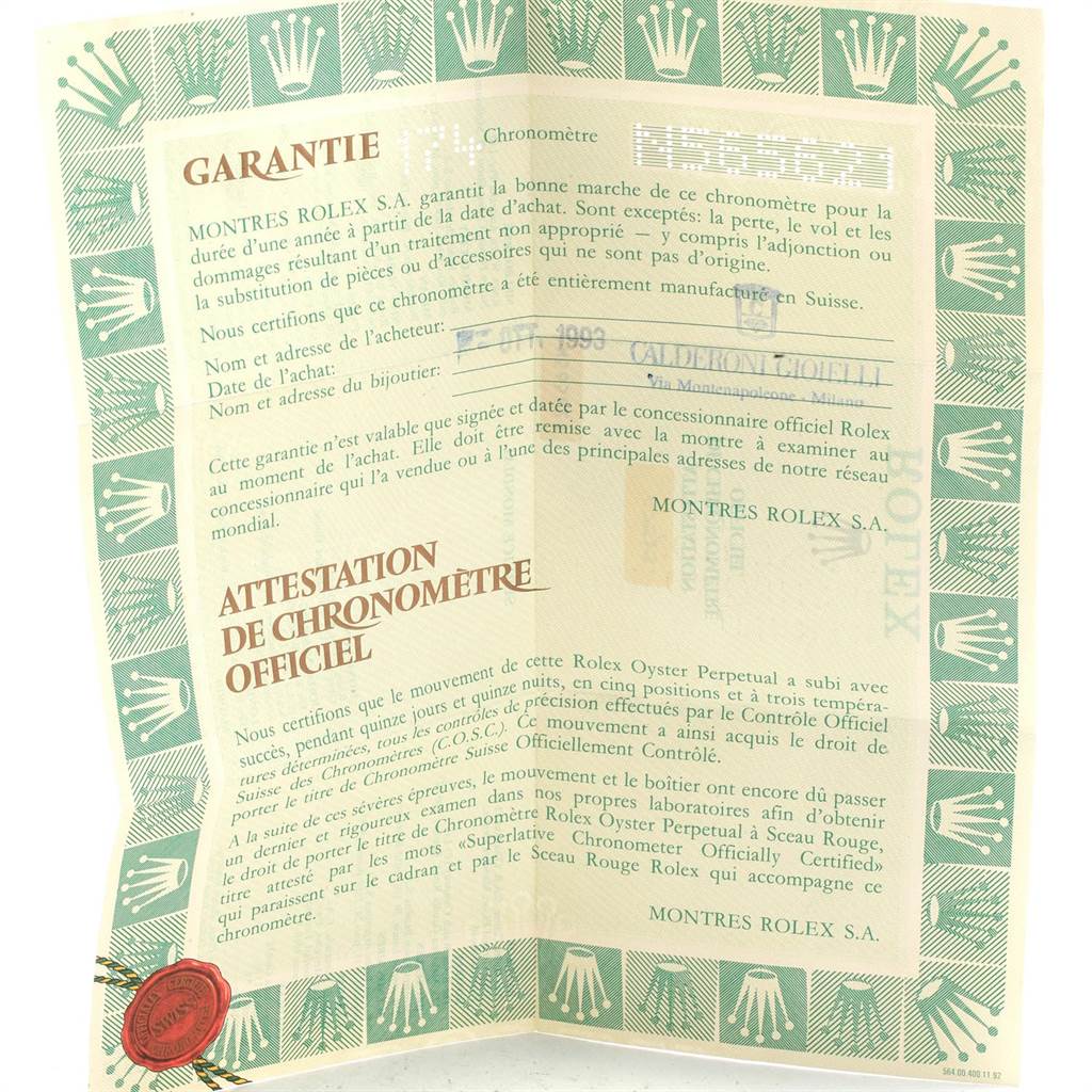 This is a warranty certificate for the Mid-Size model by Rolex, featuring text and official stamps.