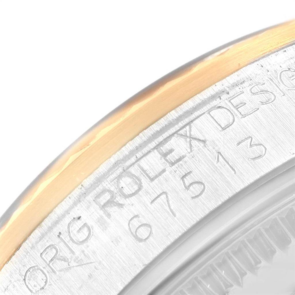 This image shows the engraved side of the watch case, highlighting the model number and brand "Rolex" on a Mid-Size model.