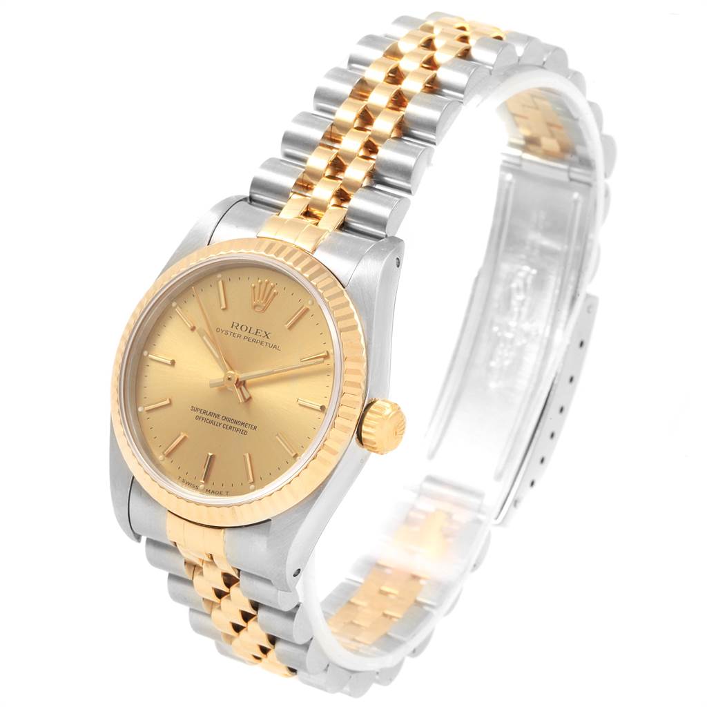 This image shows a Rolex Mid-Size 67513 Women's Steel and Gold (two tone) Champagne Dial 67513 Women's Steel and Gold (two tone) Champagne Dial model watch at a three-quarters angle featuring its face, bezel, and bracelet.