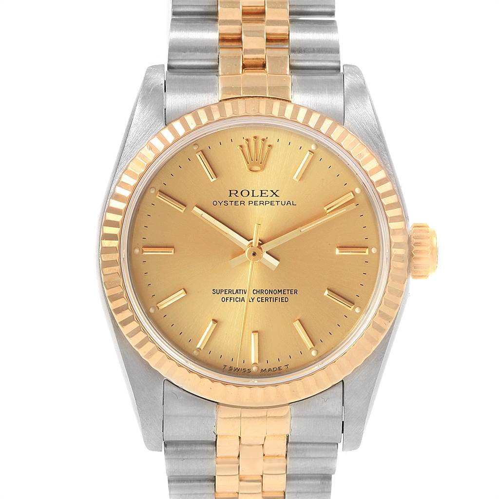 This image shows the front view of a Rolex Mid-Size 67513 Women's Steel and Gold (two tone) Champagne Dial 67513 Women's Steel and Gold (two tone) Champagne Dial model watch, highlighting its dial, bezel, case, and bracelet.