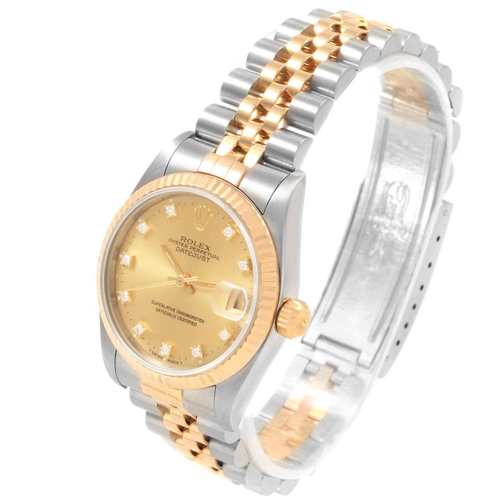 This image shows a Rolex Mid-Size 68273 Women's Steel and Gold (two tone) Champagne Dial 68273 Women's Steel and Gold (two tone) Champagne Dial Datejust watch at a slight angle, featuring its dial, crown, and two-tone bracelet.