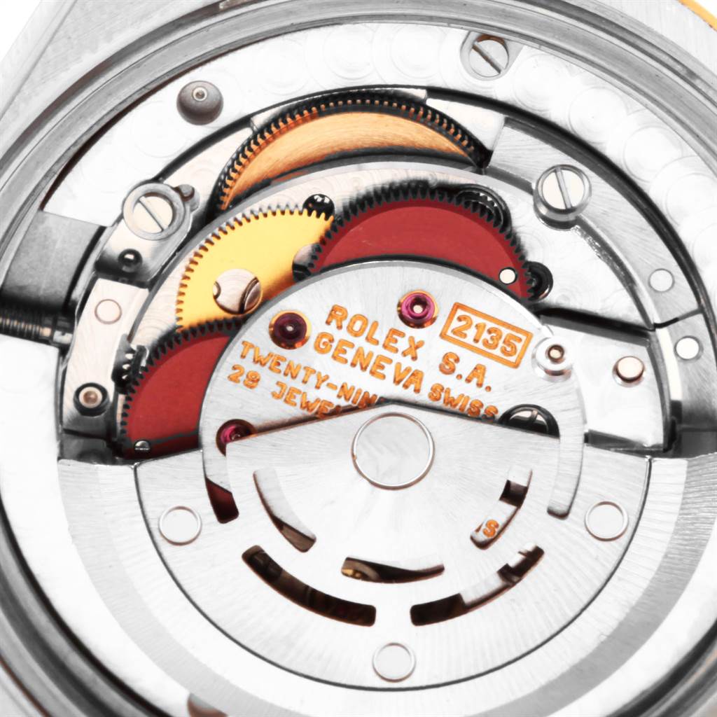 This close-up image showcases the detailed internal movement of a Rolex Mid-Size 68273 Women's Steel and Gold (two tone) Champagne Dial 68273 Women's Steel and Gold (two tone) Champagne Dial model.
