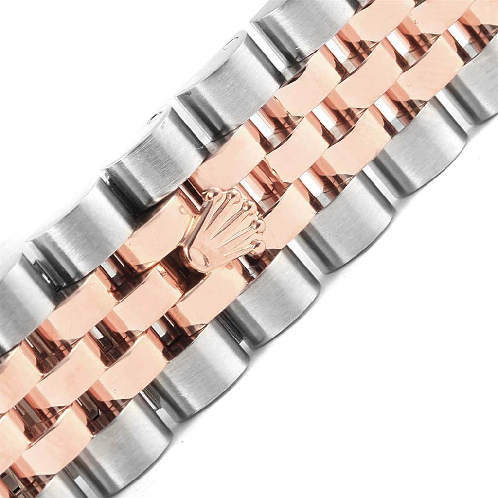 The image shows a close-up of the two-tone bracelet of a Mid-Size Rolex watch, featuring the brand's logo.