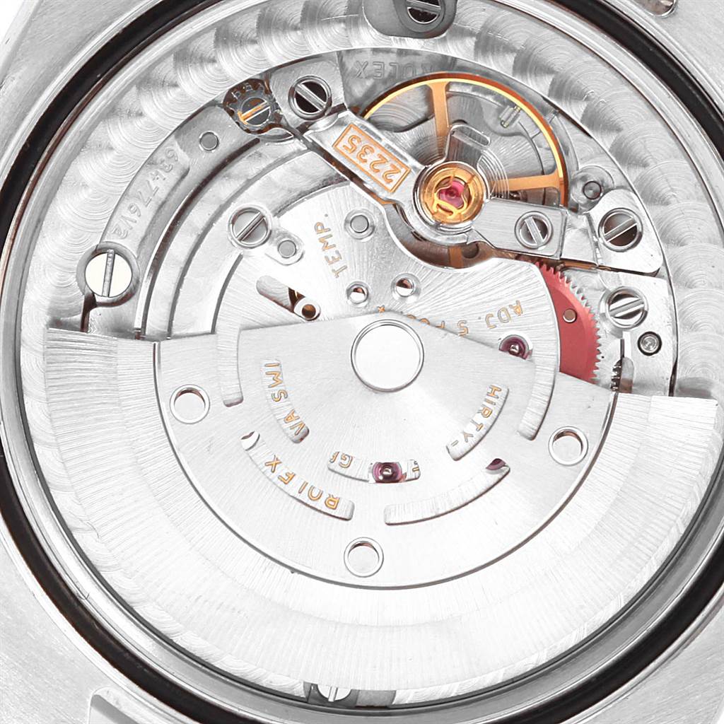 This image captures the inner mechanical movement of a mid-size Rolex watch from a rear view.