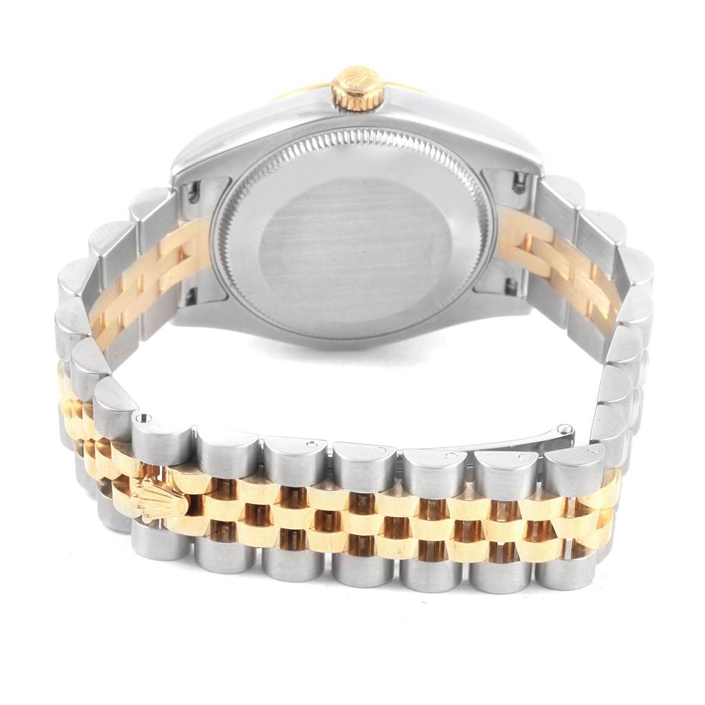 The image shows the back case and bracelet of a mid-size Rolex watch.