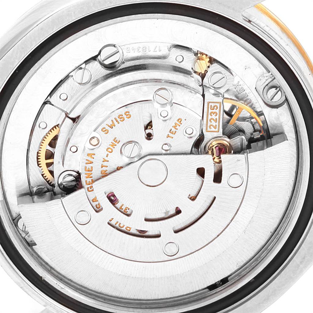 This image shows a close-up of the movement mechanism from a Rolex Mid-Size 178273 Women's Steel and Gold (two tone) White Dial 178273 Women's Steel and Gold (two tone) White Dial watch, highlighting the intricate internal components.