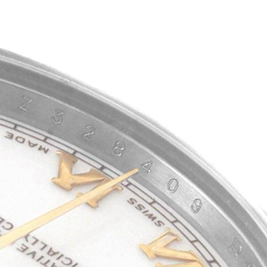 The close-up angle of the Rolex Mid-Size 178273 Women's Steel and Gold (two tone) White Dial 178273 Women's Steel and Gold (two tone) White Dial watch shows part of the dial, Roman numerals, and the edge of the bezel.
