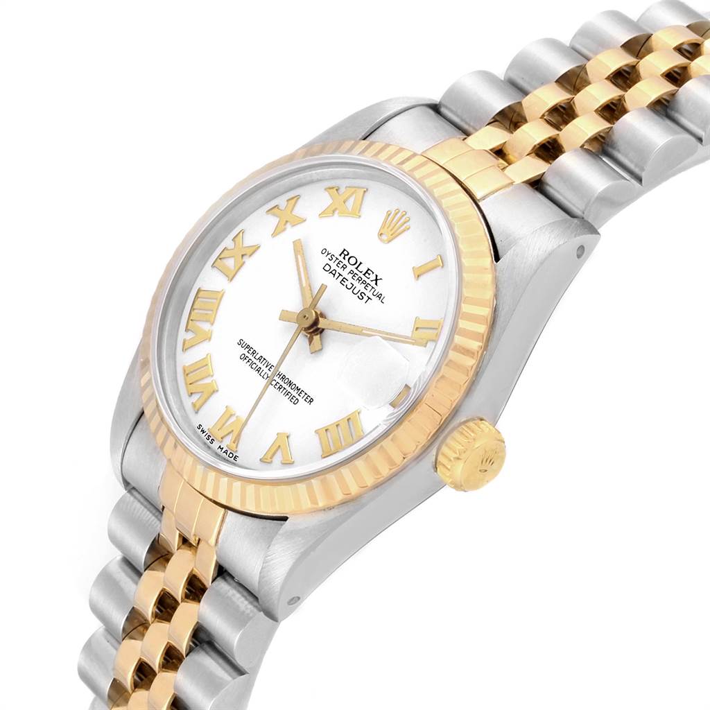 This image shows a Rolex Mid-Size 68273 Women's Steel and Gold (two tone) White Dial 68273 Women's Steel and Gold (two tone) White Dial Datejust watch at an angled side view, highlighting the bezel, crown, dial, and bracelet.