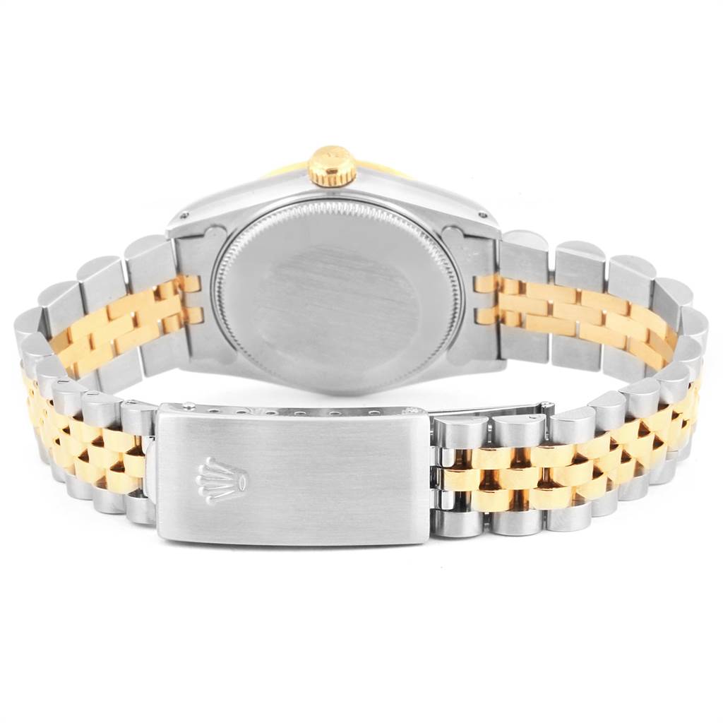 This Rolex Mid-Size 68273 Women's Steel and Gold (two tone) White Dial 68273 Women's Steel and Gold (two tone) White Dial watch is shown from the back, displaying the case, crown, and two-tone bracelet with the clasp.