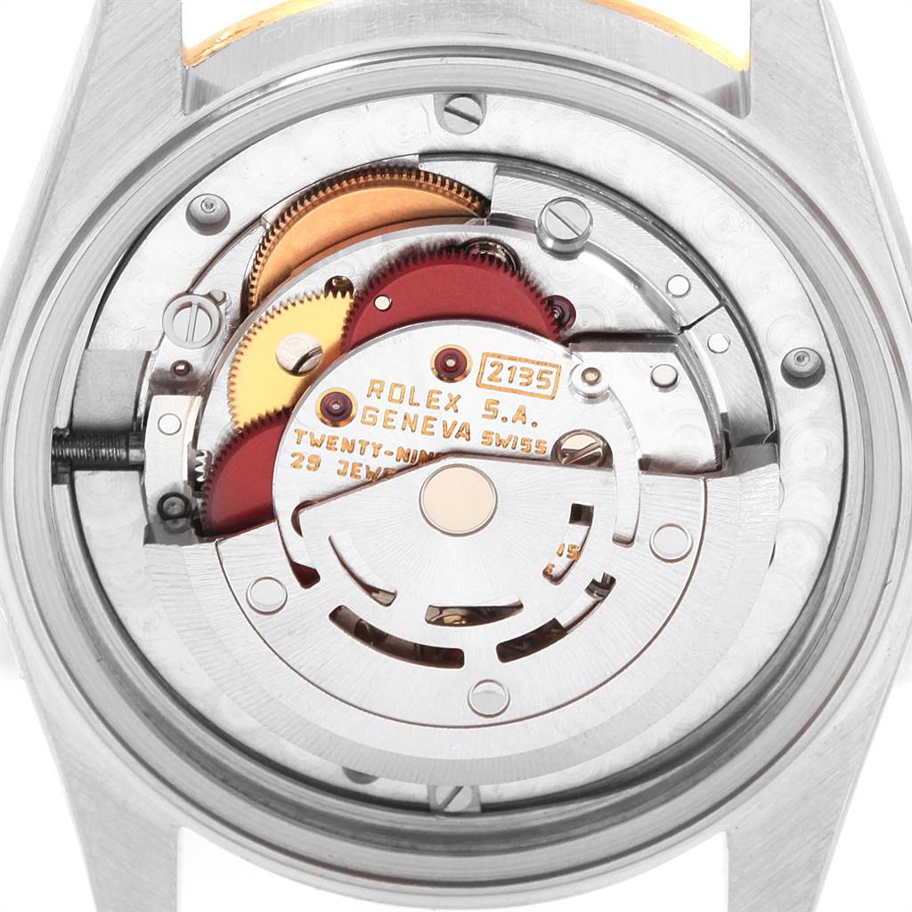 This image shows the inner workings and movement of a Rolex Mid-Size 68273 Women's Steel and Gold (two tone) White Dial 68273 Women's Steel and Gold (two tone) White Dial model watch.
