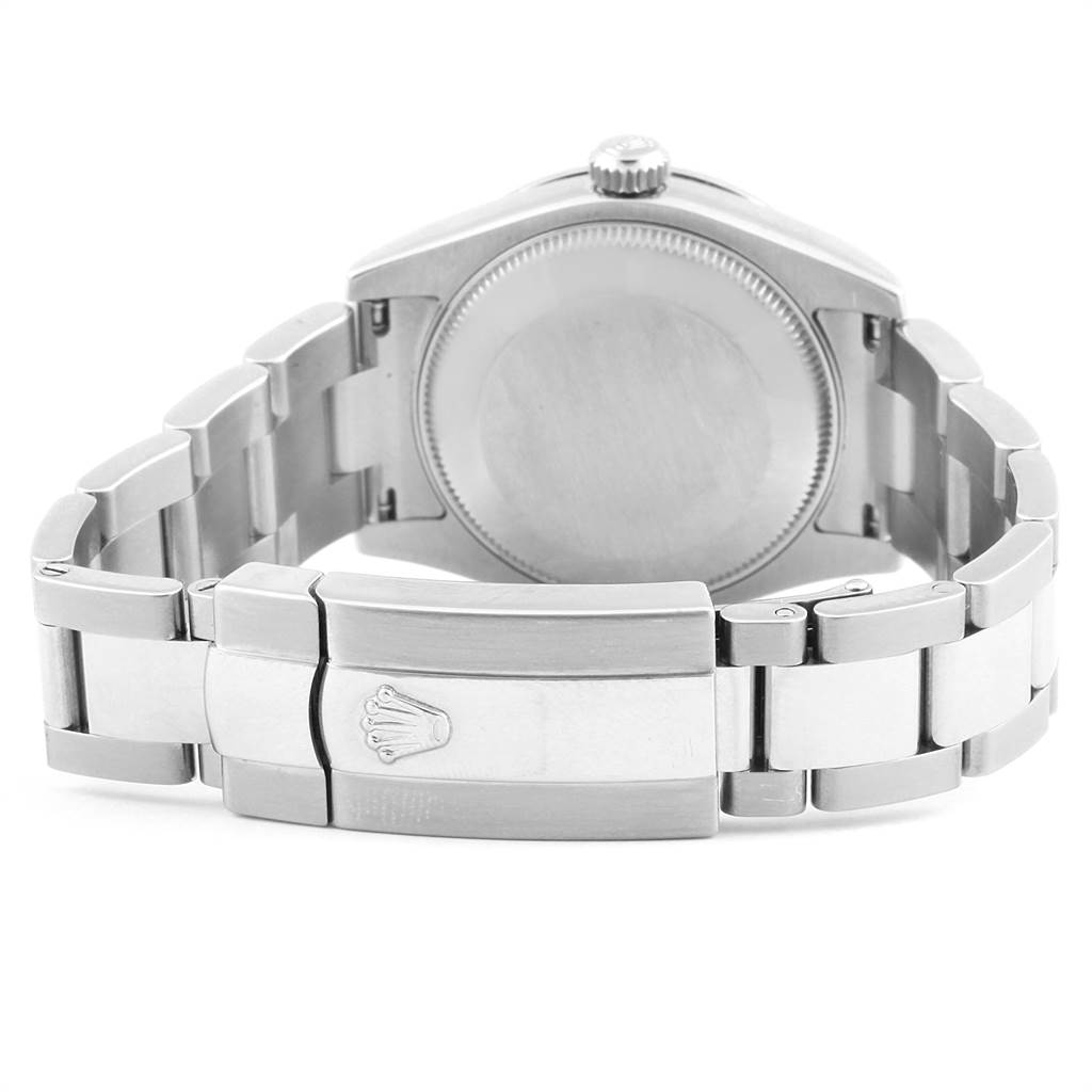 The image shows the back view, clasp, and part of the bracelet of a Mid-Size Rolex watch.