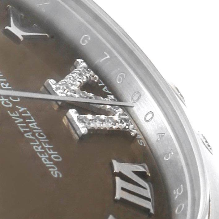 The close-up angle shows the dial, bezel, and Roman numeral markers of the Mid-Size Rolex watch.