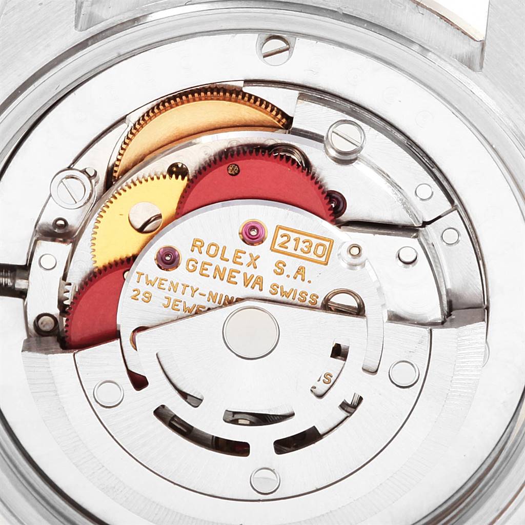 This image shows the movement mechanism of a Mid-Size Rolex watch.