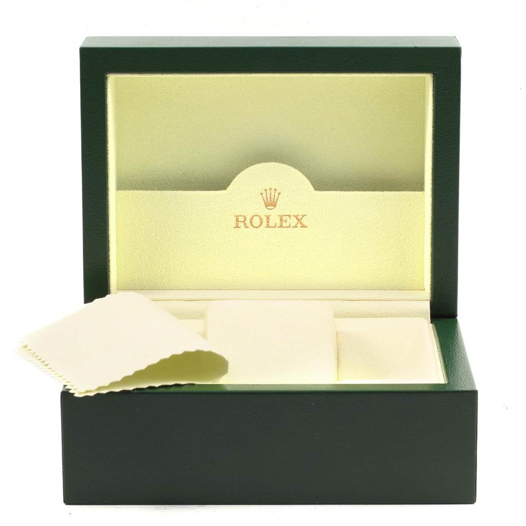 This image shows the open box and cleaning cloth for a Rolex Mid-Size 77080 Women's Stainless Steel Black Dial 77080 Women's Stainless Steel Black Dial model watch, viewed from the front.