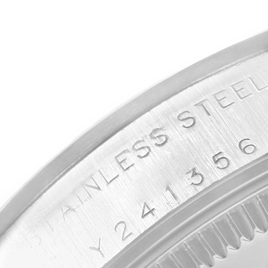 The image shows a close-up of the side engraving on the bezel of a Mid-Size Rolex watch.