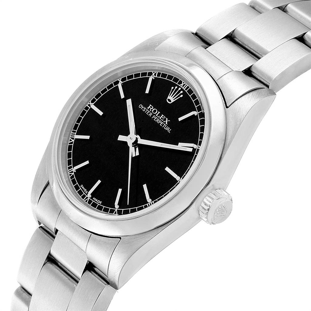 The image shows a close-up, angled view of a Mid-Size Rolex Oyster Perpetual watch, displaying the dial, crown, and bracelet.