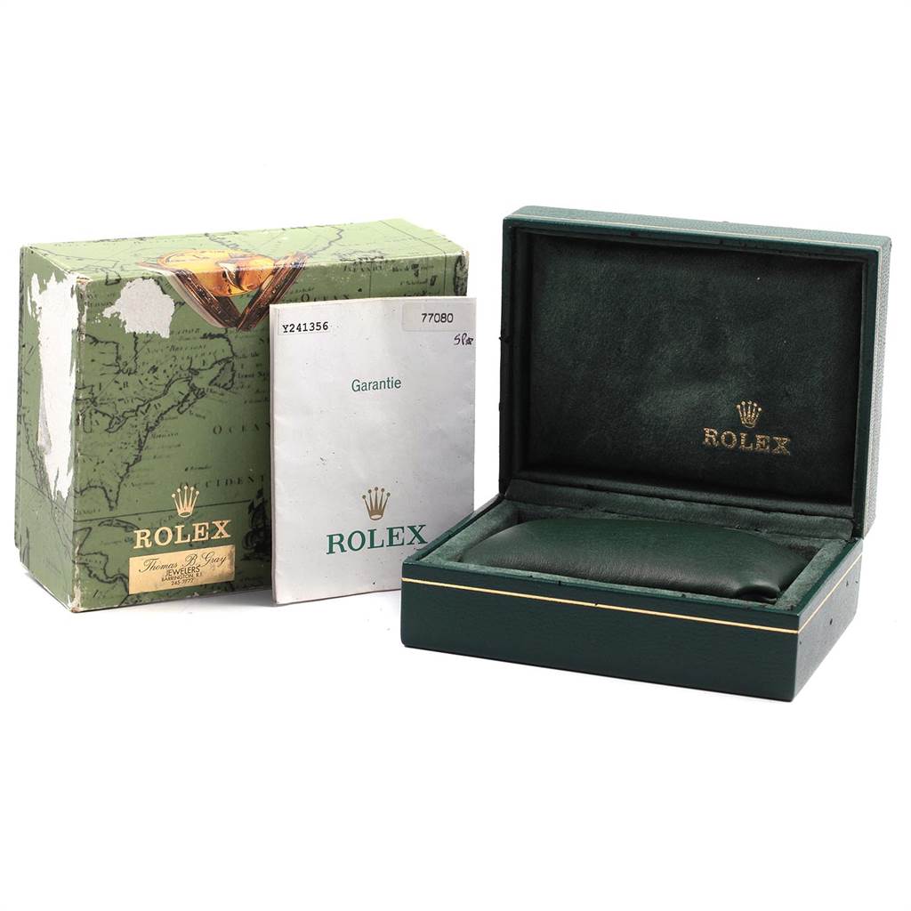 The image shows a Rolex Mid-Size 77080 Women's Stainless Steel Black Dial 77080 Women's Stainless Steel Black Dial model's empty box, warranty card, and packaging from a front-left angle.