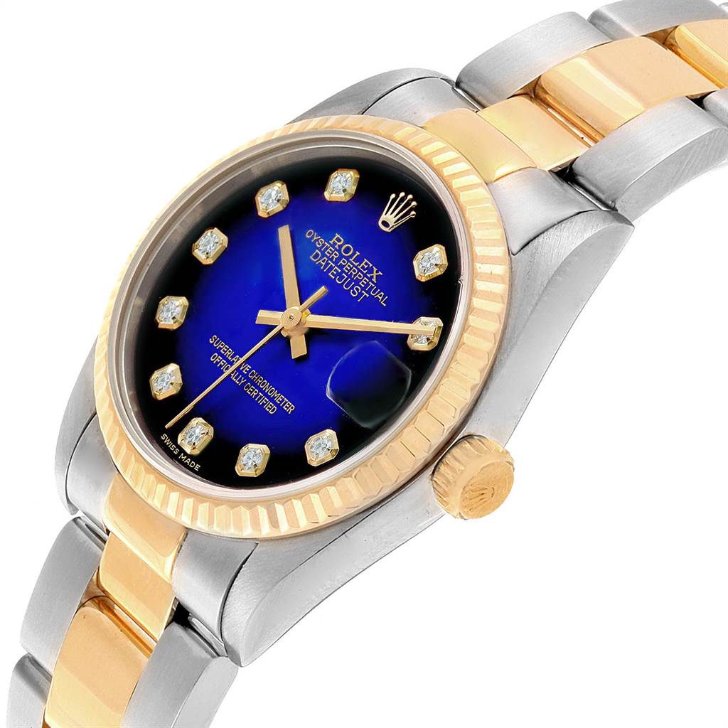 The image shows a Rolex Mid-Size 68273 Women's Steel and Gold (two tone) Blue Dial 68273 Women's Steel and Gold (two tone) Blue Dial Datejust watch at a slight angle, highlighting the dial, fluted bezel, and the two-tone bracelet.