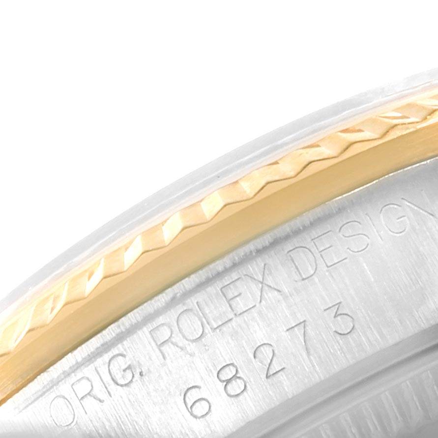 This is a close-up of the bezel and case of the Rolex Mid-Size 68273 Women's Steel and Gold (two tone) Blue Dial 68273 Women's Steel and Gold (two tone) Blue Dial model, showing the model number "68273."