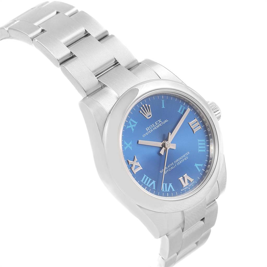 The image shows a side angle of a Mid-Size Rolex Oyster Perpetual watch, highlighting its blue dial, Roman numerals, and metal bracelet.