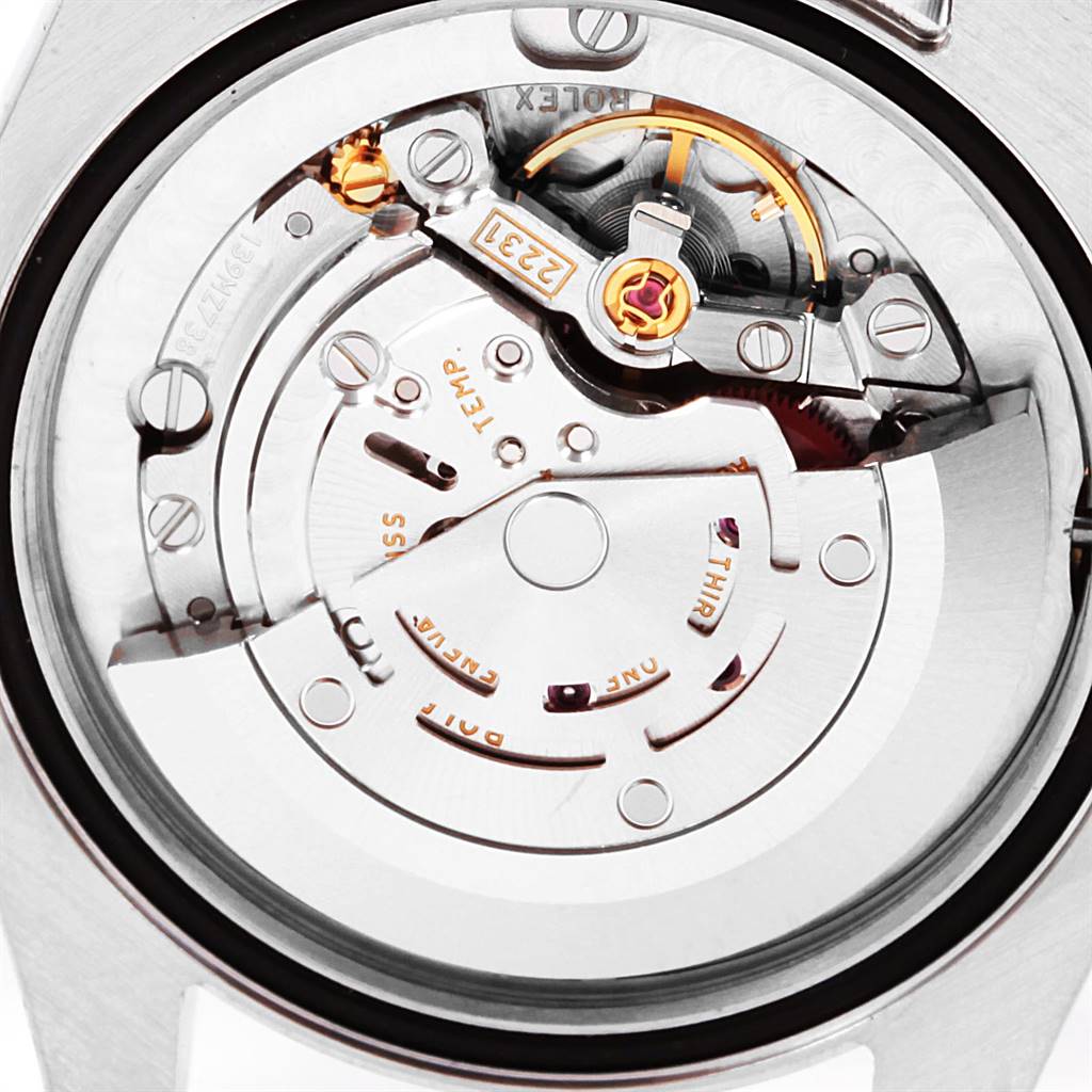 The image displays the intricate internal mechanism of a Rolex Mid-Size 177200 Women's Stainless Steel Blue Dial 177200 Women's Stainless Steel Blue Dial model watch from an overhead angle.