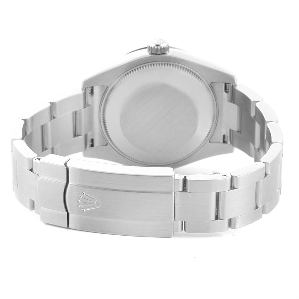 The image shows the back view of a Mid-Size Rolex watch, emphasizing the case back and the clasp.