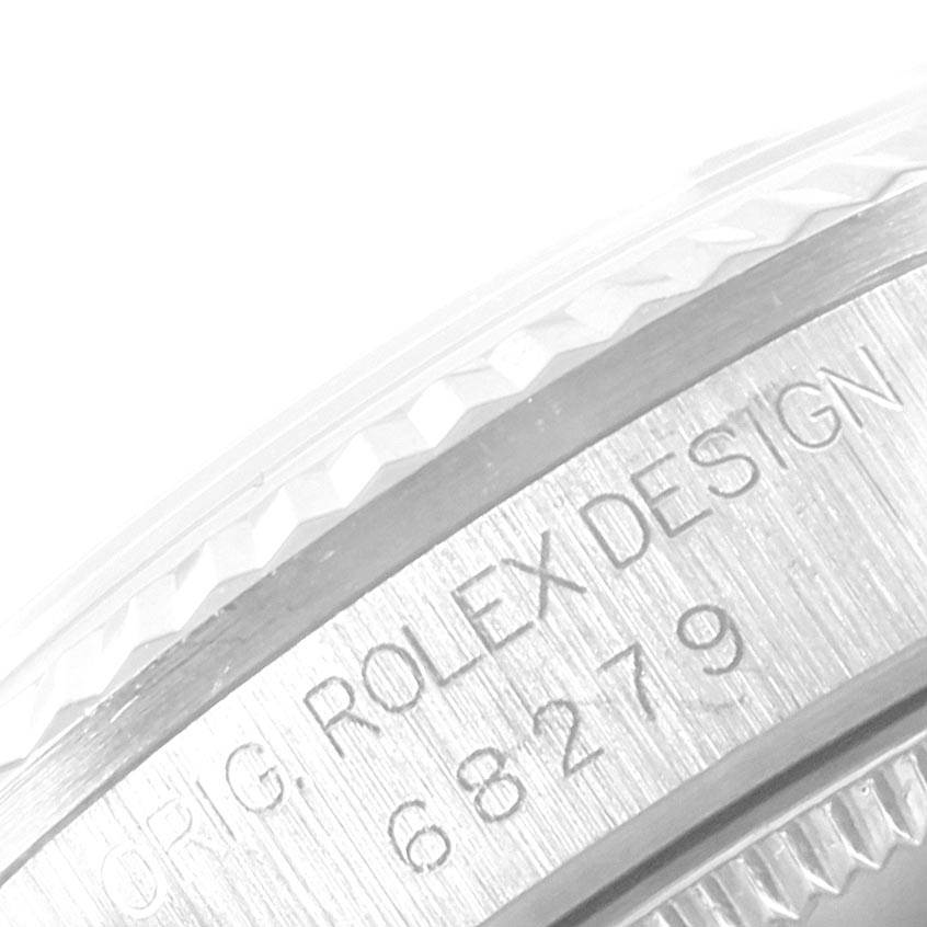 This image shows a close-up of the side engraving on a Mid-Size Rolex watch, revealing the "ROLEX DESIGN" and model number.