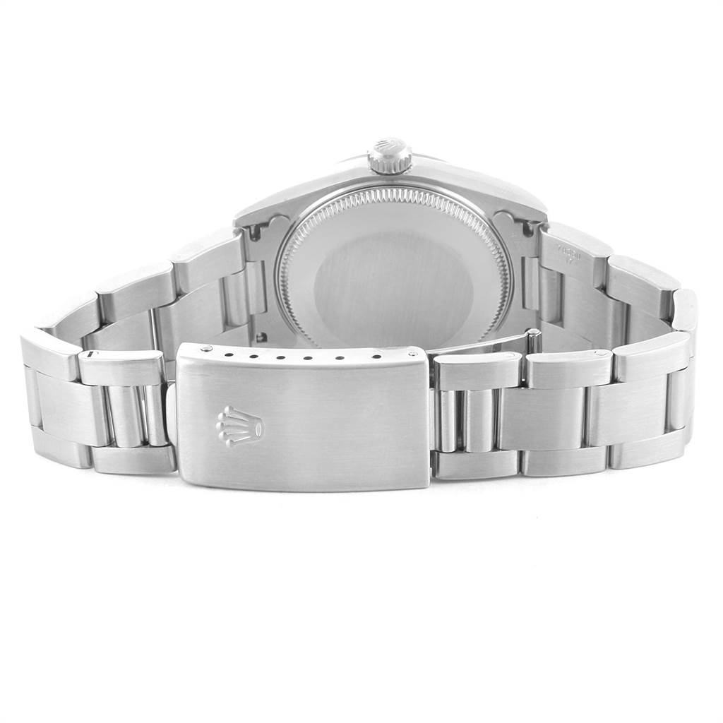 This image shows the back of a Mid-Size Rolex watch, highlighting its closed clasp, bracelet, and case back.