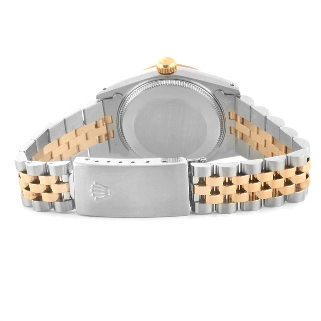 This image shows the back casing and the bracelet of a Mid-Size model Rolex watch, featuring a two-tone metal design.