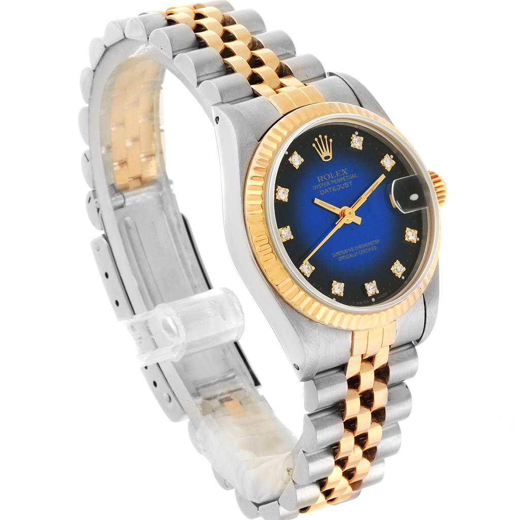 This image shows a Rolex Mid-Size 68273 Women's Steel and Gold (two tone) Blue Dial 68273 Women's Steel and Gold (two tone) Blue Dial Datejust watch from an angled perspective, highlighting the bracelet, bezel, and dial.