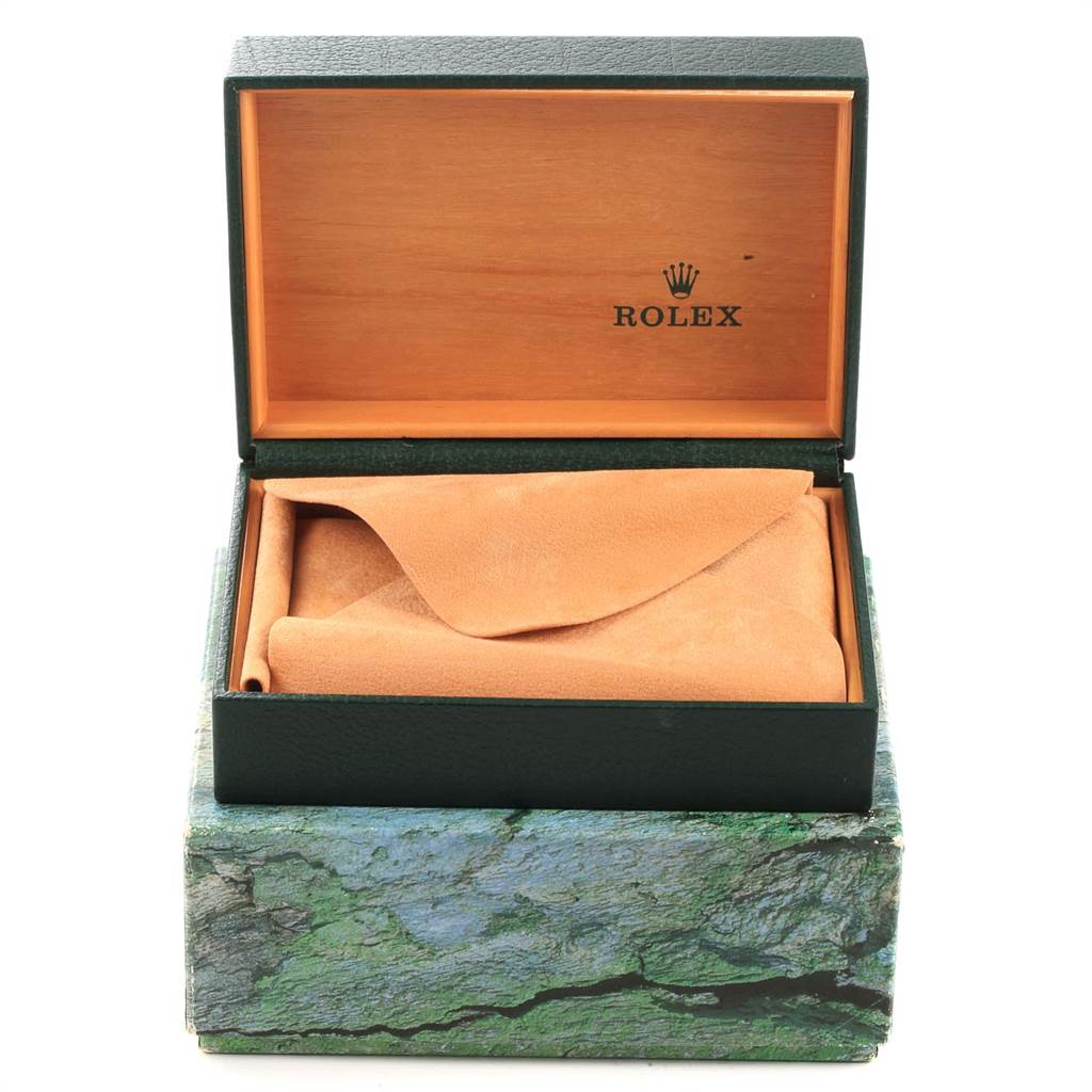 The image shows a top-down view of a Rolex Mid-Size 68273 Women's Steel and Gold (two tone) Blue Dial 68273 Women's Steel and Gold (two tone) Blue Dial model watch box, partially open with a suede pouch inside.