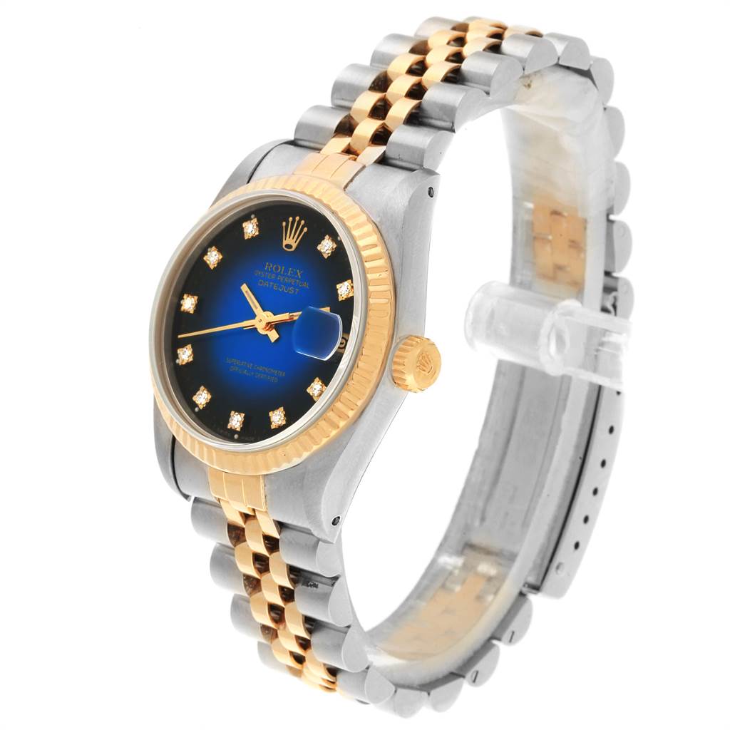 The image shows a Rolex Mid-Size 68273 Women's Steel and Gold (two tone) Blue Dial 68273 Women's Steel and Gold (two tone) Blue Dial Datejust watch at a three-quarter angle, highlighting the dial, bezel, band, and crown.