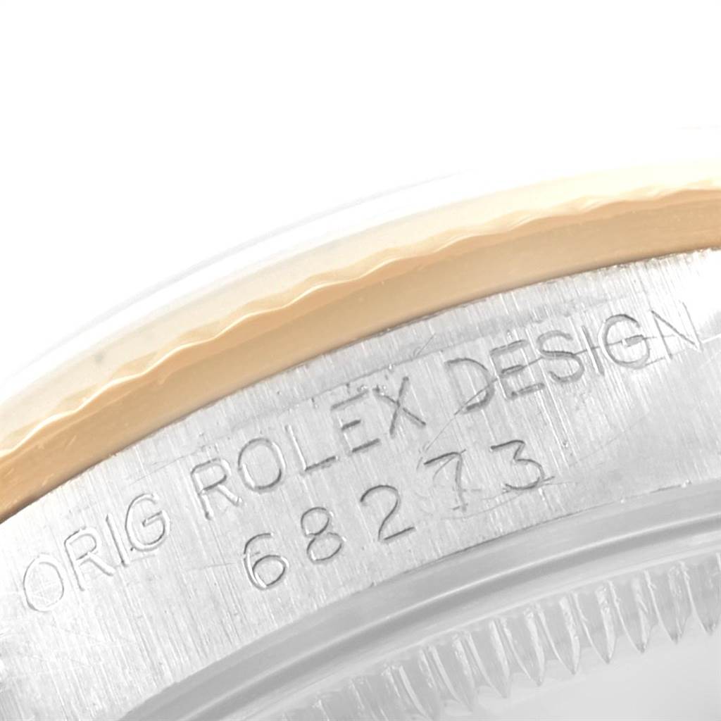 The image shows a close-up of the bezel and case back engraving of a Mid-Size Rolex watch, displaying the model number 68273.
