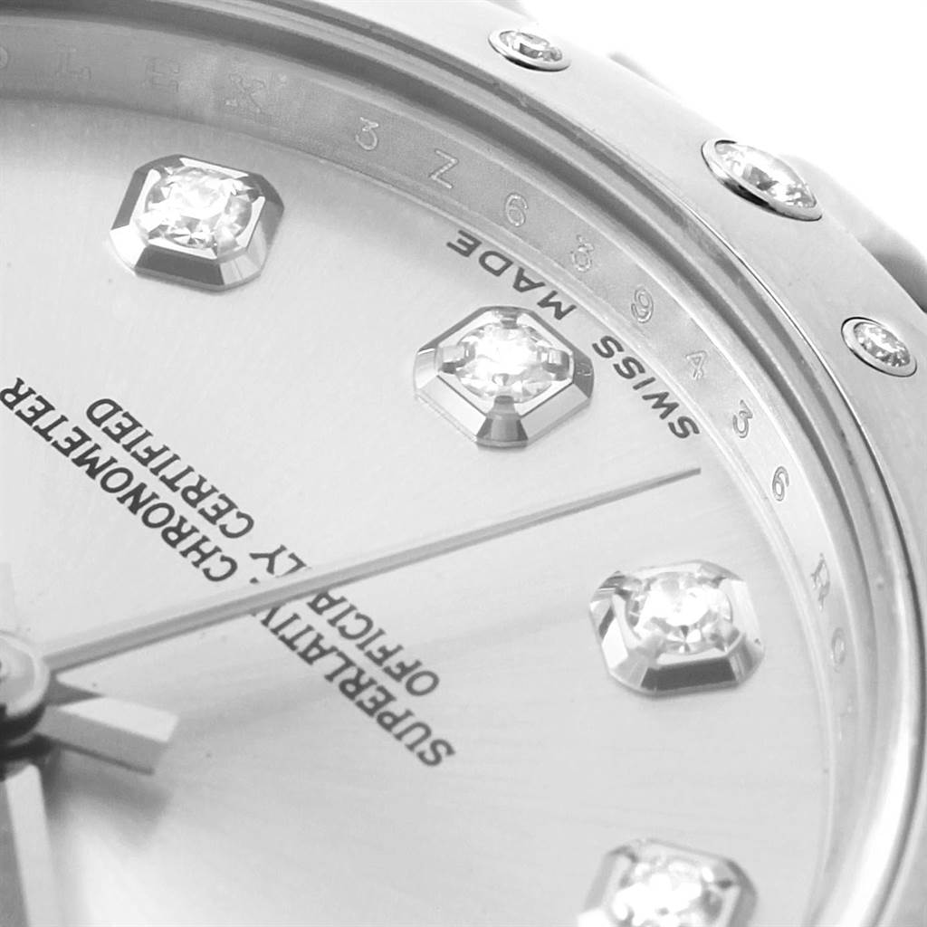 This image shows a close-up view of the dial and bezel of the Rolex Mid-Size 178344 Women's Stainless Steel Silver Dial 178344 Women's Stainless Steel Silver Dial model, highlighting diamond hour markers and "Swiss Made" lettering.