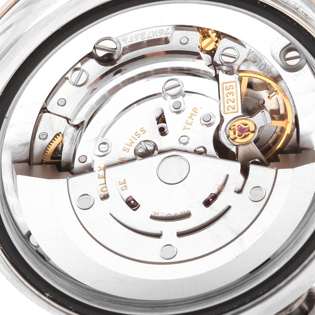 The image shows the internal mechanism of a Mid-Size Rolex watch from an overhead angle.