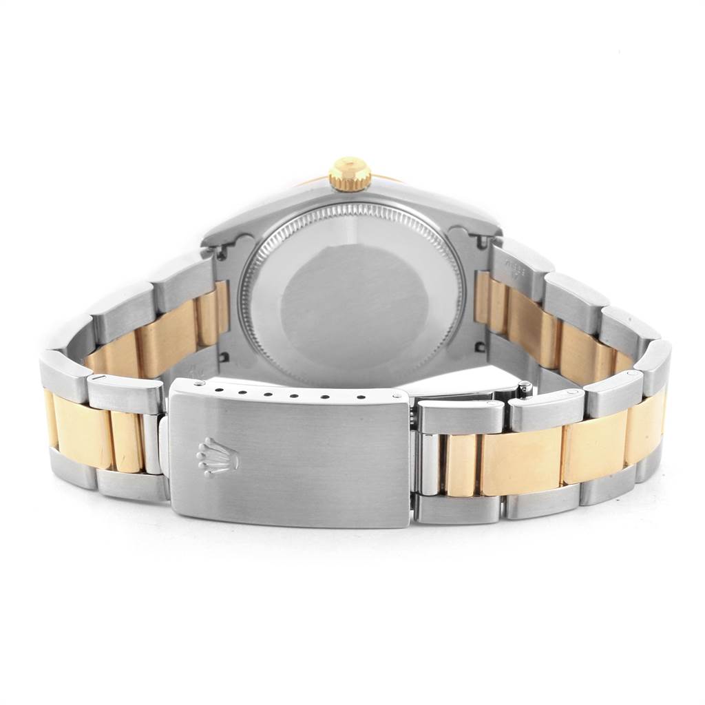 This image shows the backside and clasp of a two-tone Rolex Mid-Size 67483 Women's Steel and Gold (two tone) Grey Dial 67483 Women's Steel and Gold (two tone) Grey Dial model watch.