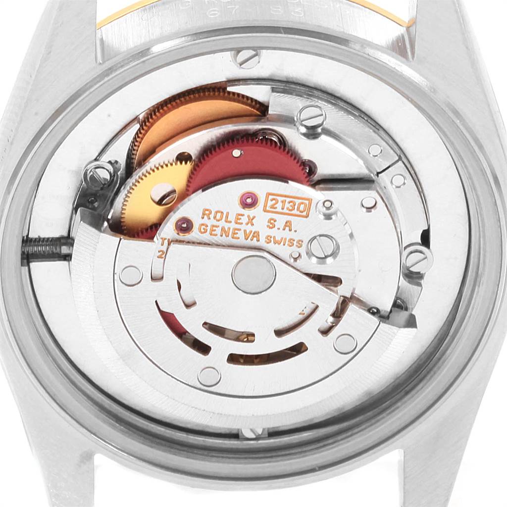 This image shows the back view of the Rolex Mid-Size 67483 Women's Steel and Gold (two tone) Grey Dial 67483 Women's Steel and Gold (two tone) Grey Dial model, highlighting its intricate movement mechanism.