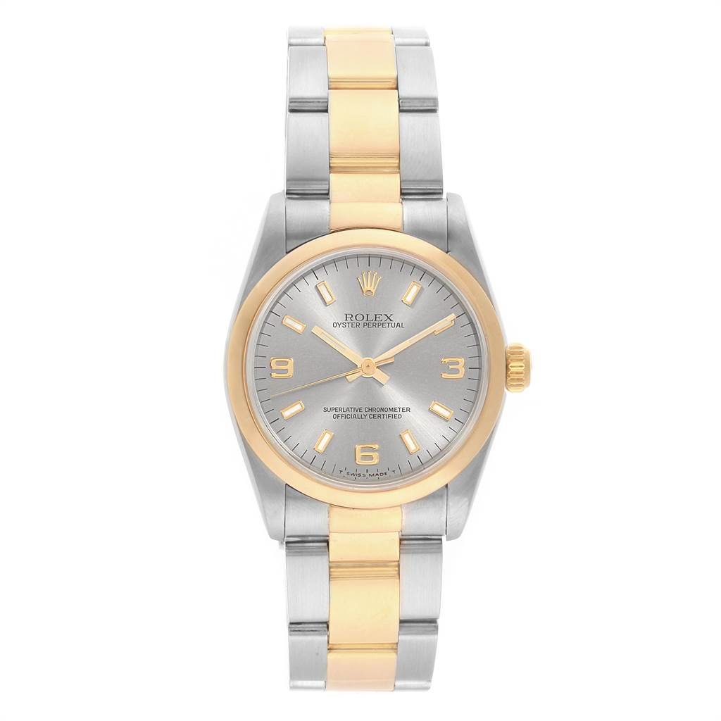 The image shows a frontal view of a Rolex Mid-Size 67483 Women's Steel and Gold (two tone) Grey Dial 67483 Women's Steel and Gold (two tone) Grey Dial Oyster Perpetual watch with a two-tone band and a gold and silver dial.