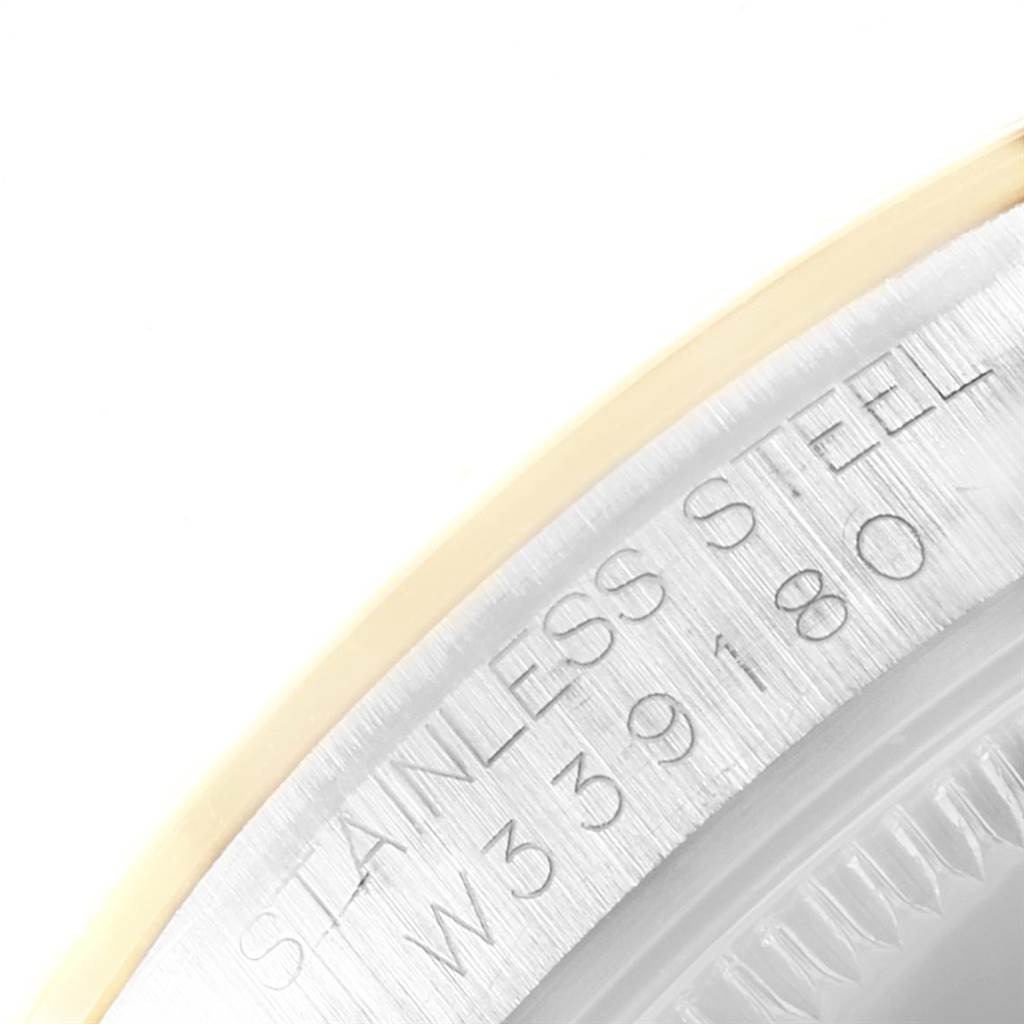 The image shows a close-up of the case edge with engraving details of a Rolex Mid-Size 67483 Women's Steel and Gold (two tone) Grey Dial 67483 Women's Steel and Gold (two tone) Grey Dial model watch.
