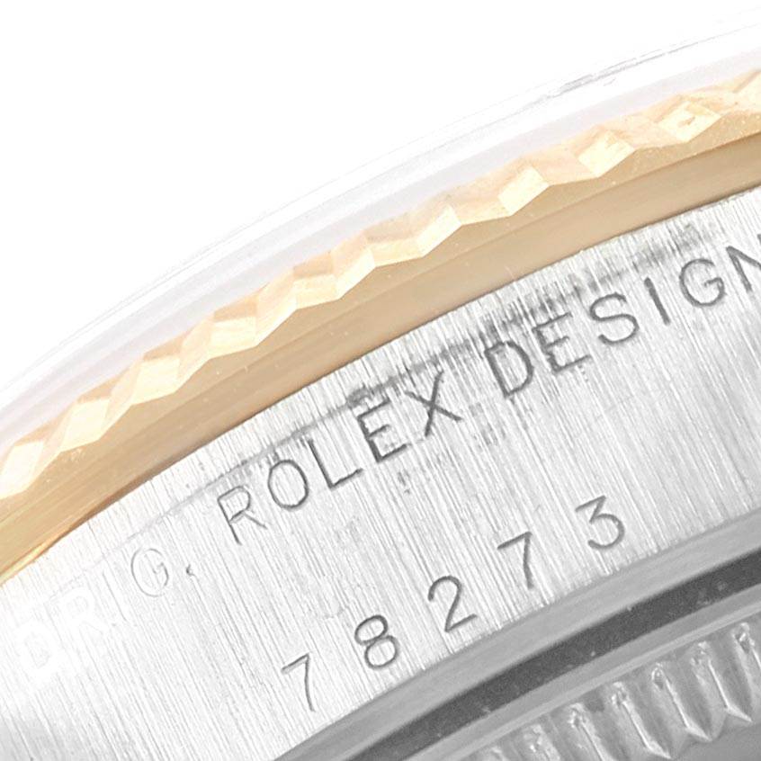The image shows a close-up of the side view of a Mid-Size Rolex watch, highlighting the engraved model number and part of the bezel.
