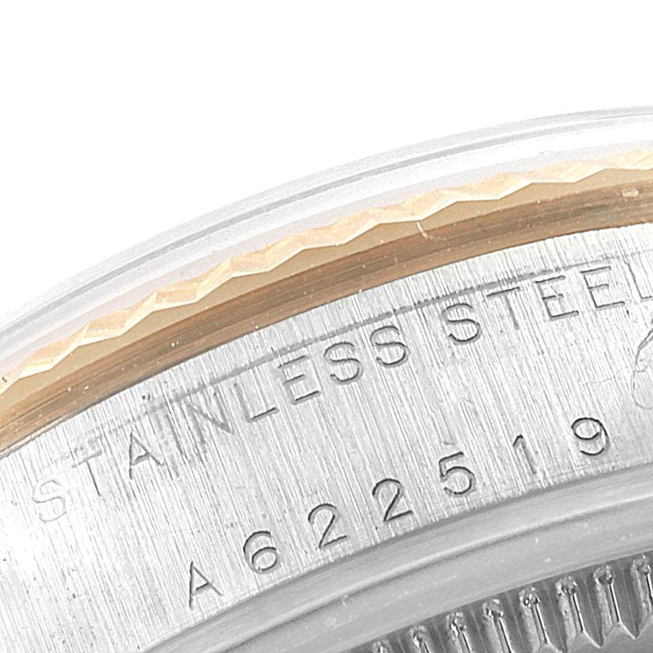 This image of the Rolex Mid-Size 78273 Women's Steel and Gold (two tone) Mother of Pearl Dial 78273 Women's Steel and Gold (two tone) Mother of Pearl Dial model shows a close-up of the bezel and case-back, highlighting the stainless steel engraving.