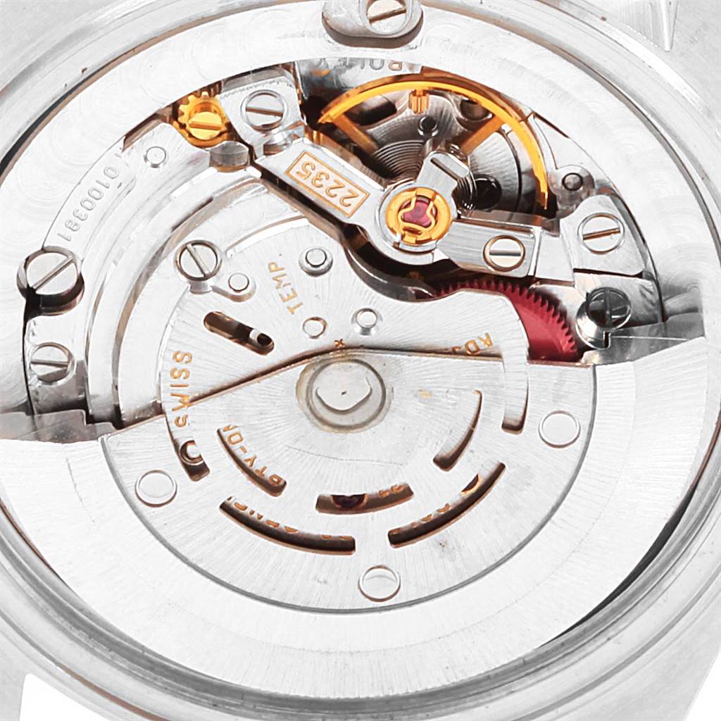 This image shows the internal mechanism and movement components of a Mid-Size Rolex watch.
