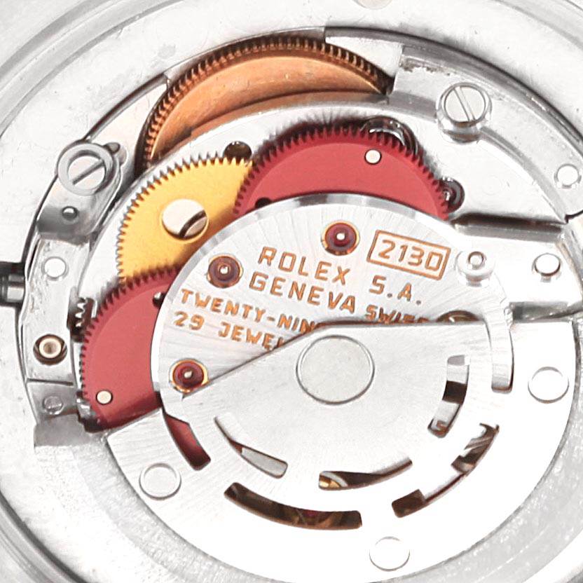 The image shows a close-up view of the Rolex Mid-Size 67480 Women's Stainless Steel Silver Dial 67480 Women's Stainless Steel Silver Dial model's internal automatic movement mechanism.