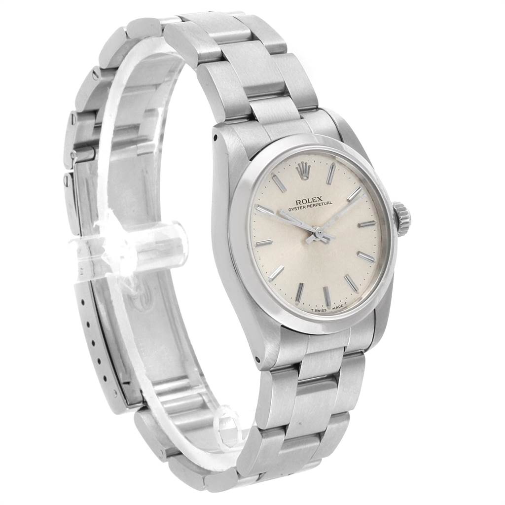 The image shows a Rolex Oyster Perpetual Mid-Size watch from a three-quarter angle, highlighting the face and bracelet.